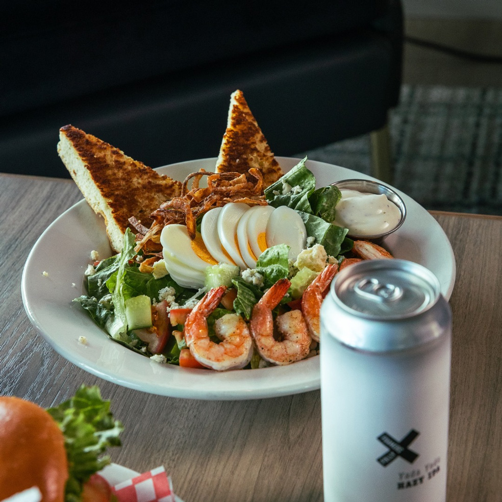 A-plate-of-salad-with-shrimp-bread-and-a-can-Pitt-Meadows-Golf-Club